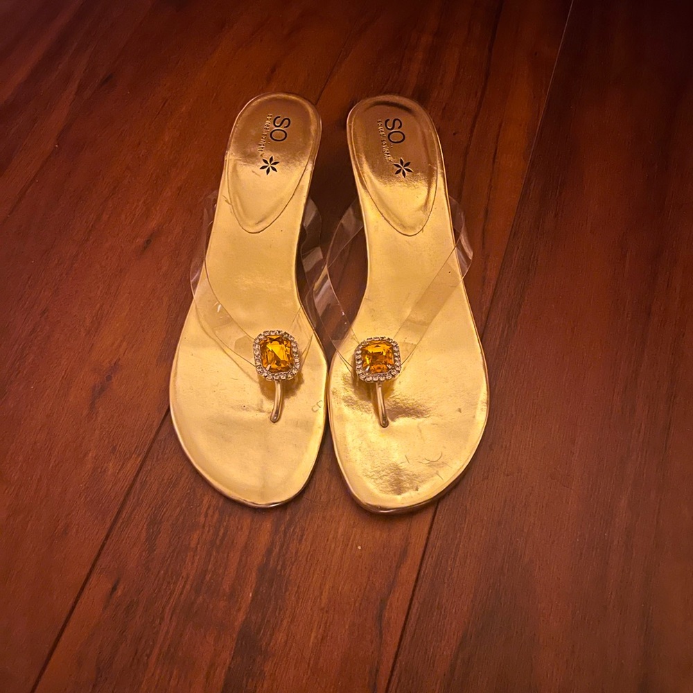 New, Sandal with clear strap embellished and a rhinestone traced 'jewel'.